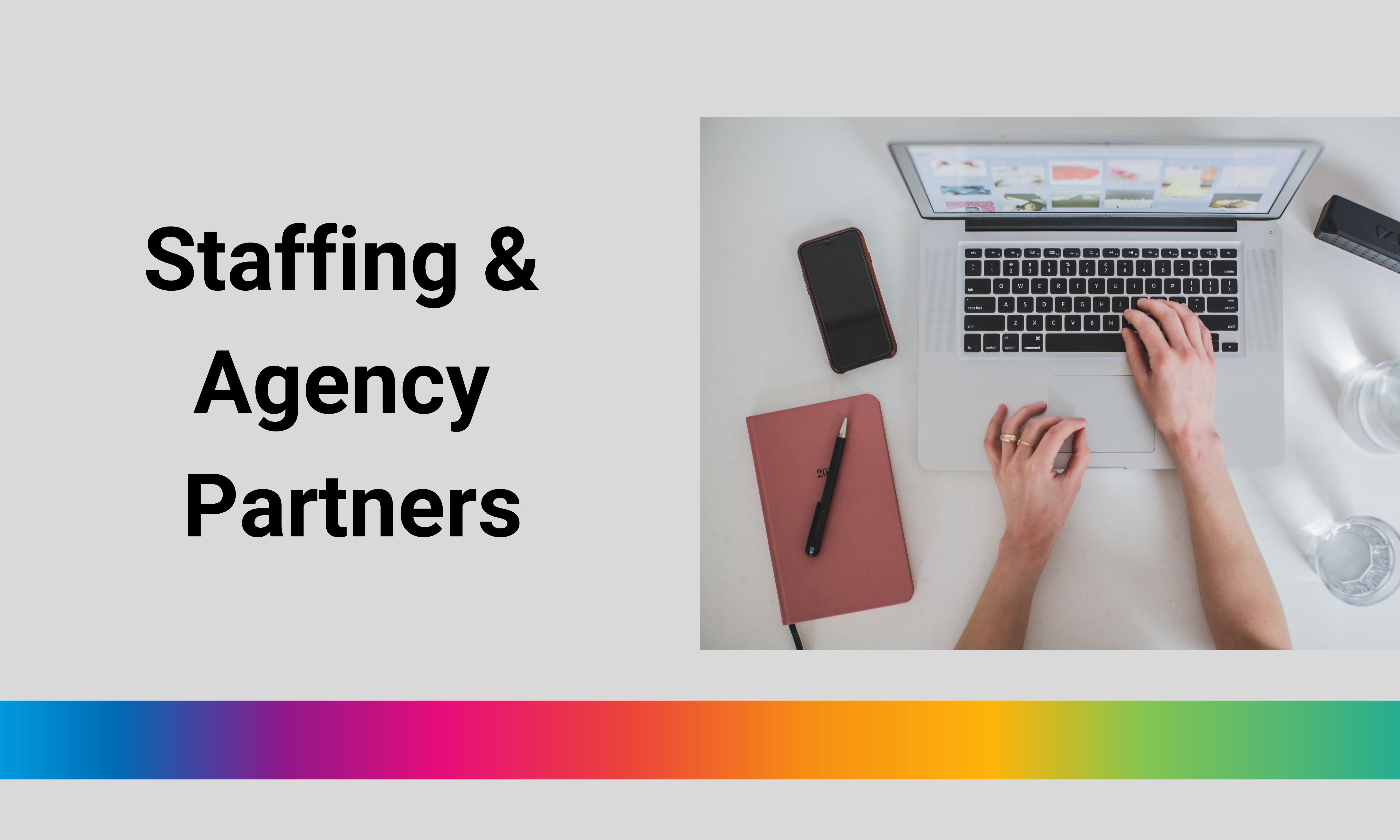 Aerial view of hands typing on a computer